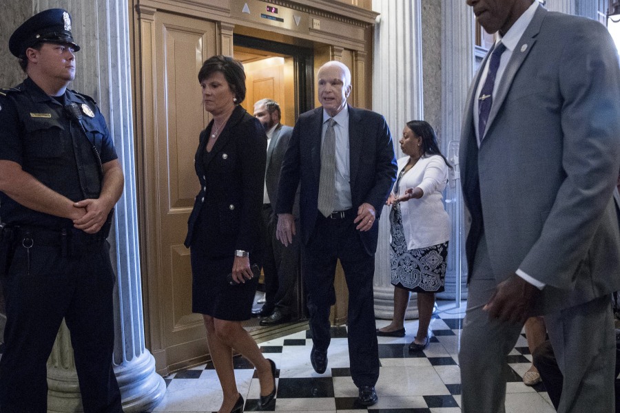 Sen. John McCain, R-Ariz. arrives on Capitol Hill in Washington on Tuesday as the Senate was to vote on moving head on health care with the goal of erasing much of Barack Obama’s law.