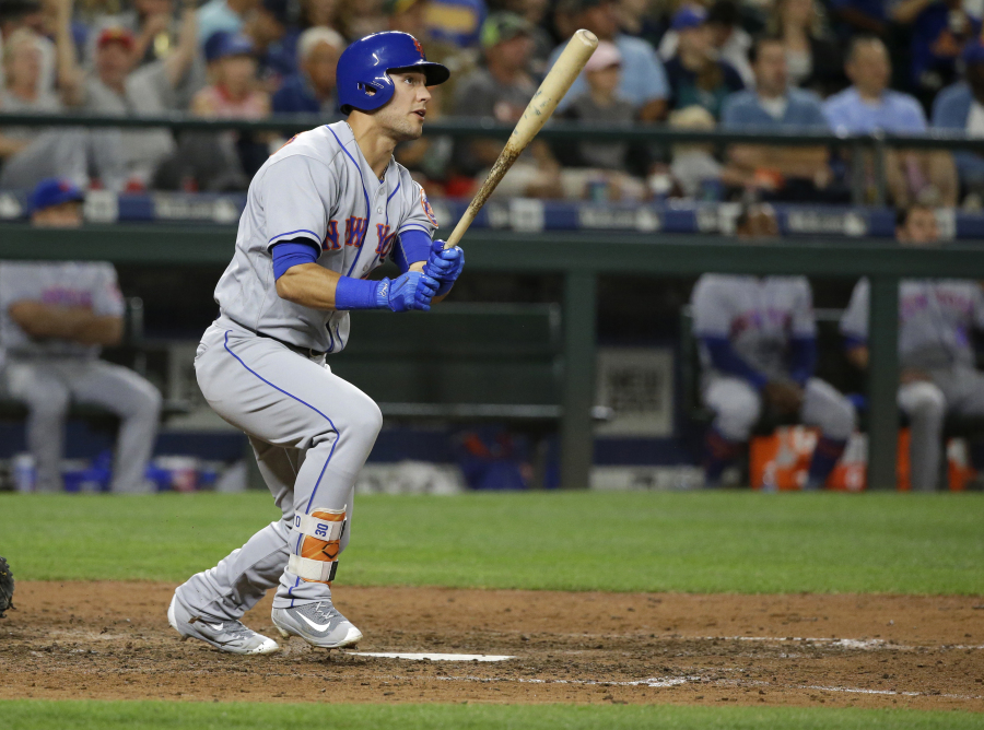 New York Mets’ Michael Conforto watches his solo home run during the eighth inning of the team’s baseball game against Seattle Mariners, Friday, July 28, 2017, in Seattle. Conforto also homered in the third inning. (AP Photo/Ted S.