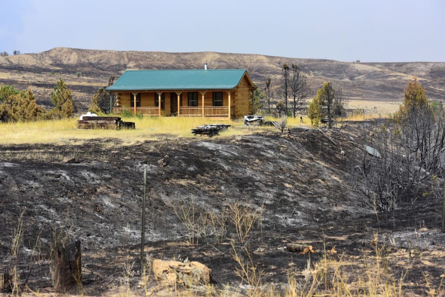 A structure remains standing after the Bridge Coulee fire in the Lodgepole Complex fire swept through the area near Sand Springs, Mont. on Sunday, July 23, 2017.