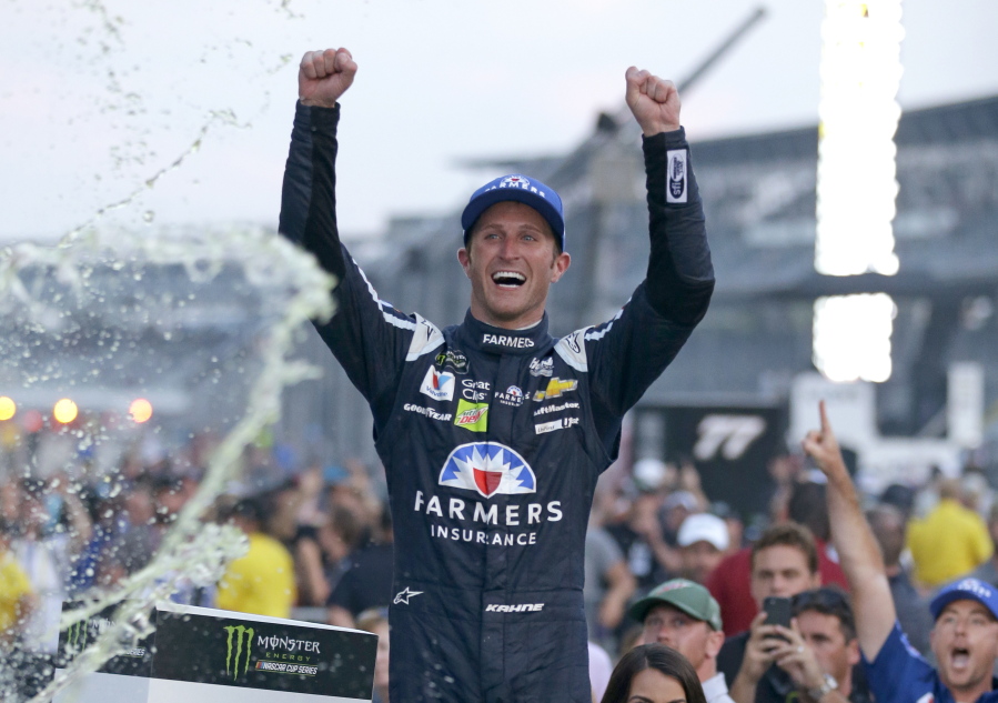 Kasey Kahne (5) celebrates winning the NASCAR Brickyard 400 auto race at Indianapolis Motor Speedway in Indianapolis, Sunday, July 23, 2017.