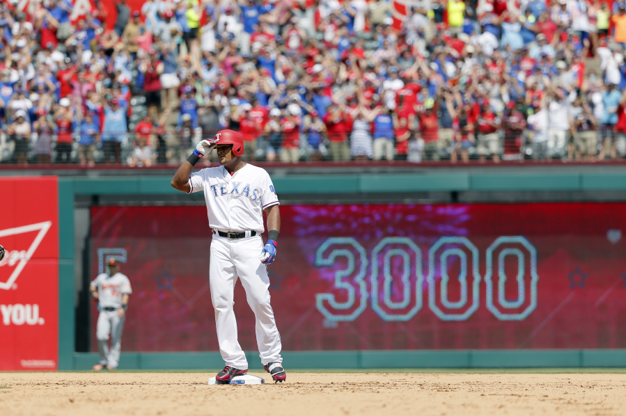 Texas Rangers’ Adrian Beltre tips his helmet as he acknowledges cheers after hitting a double for his 3,000th career hit that came off a pitch from Baltimore Orioles’ Wade Miley in the fourth inning of a baseball game, Sunday, July 30, 2017, in Arlington, Texas.