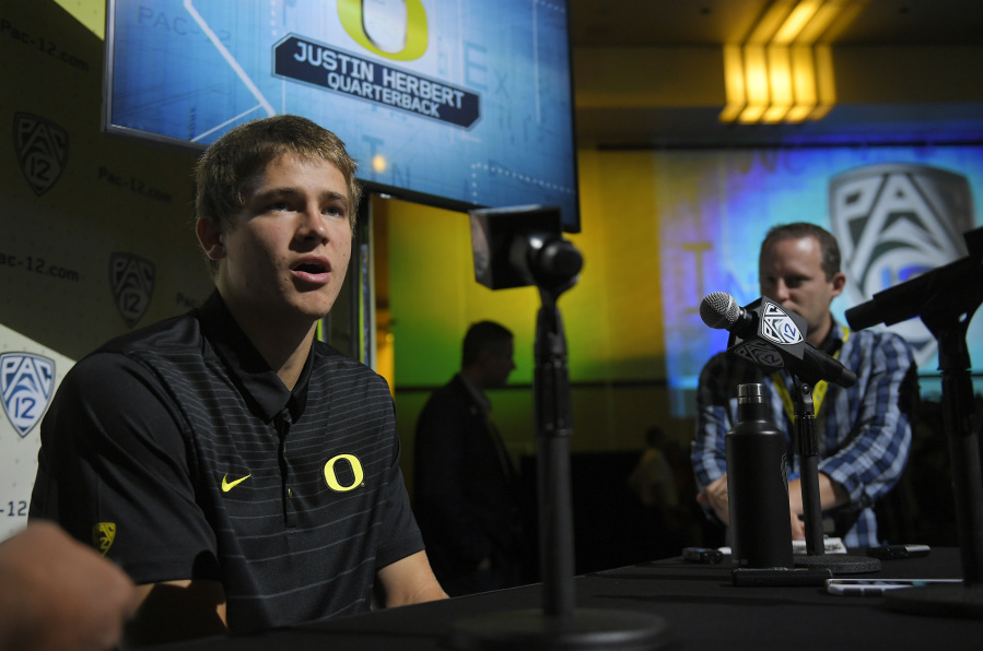 Oregon quarterback Justin Herbert speaks at the Pac-12 NCAA college football media day, Thursday, July 27, 2017, in the Hollywood section of Los Angeles. (AP Photo/Mark J.