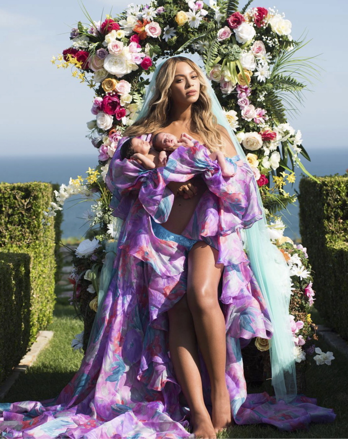 In this undated image released by Parkwood Entertainment on Friday, July 14, 2017, Beyonce posed with her newborn twins Sir Carter and Rumi. The singer posted the picture on Instagram late Thursday night and wrote in the caption, "Sir Carter and Rumi 1 month today." She didn't mention the babies' genders, but Beyonce's mother wrote on Instagram that the pop star had given birth to a boy and a girl.