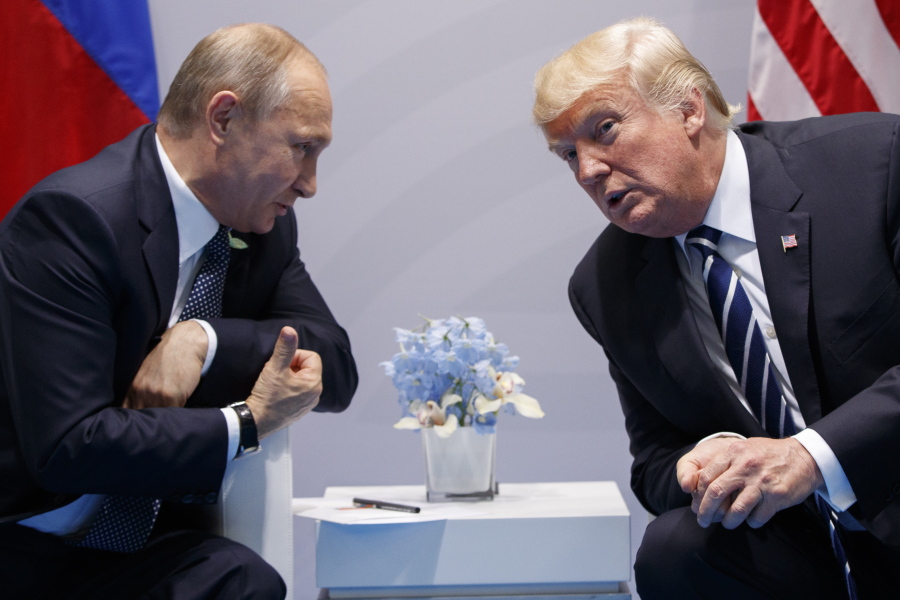 U.S. President Donald Trump, right, talks with Russian President Vladimir Putin on Friday at the G-20 Summit in Hamburg, Germany. The two leaders met for more than two hours.