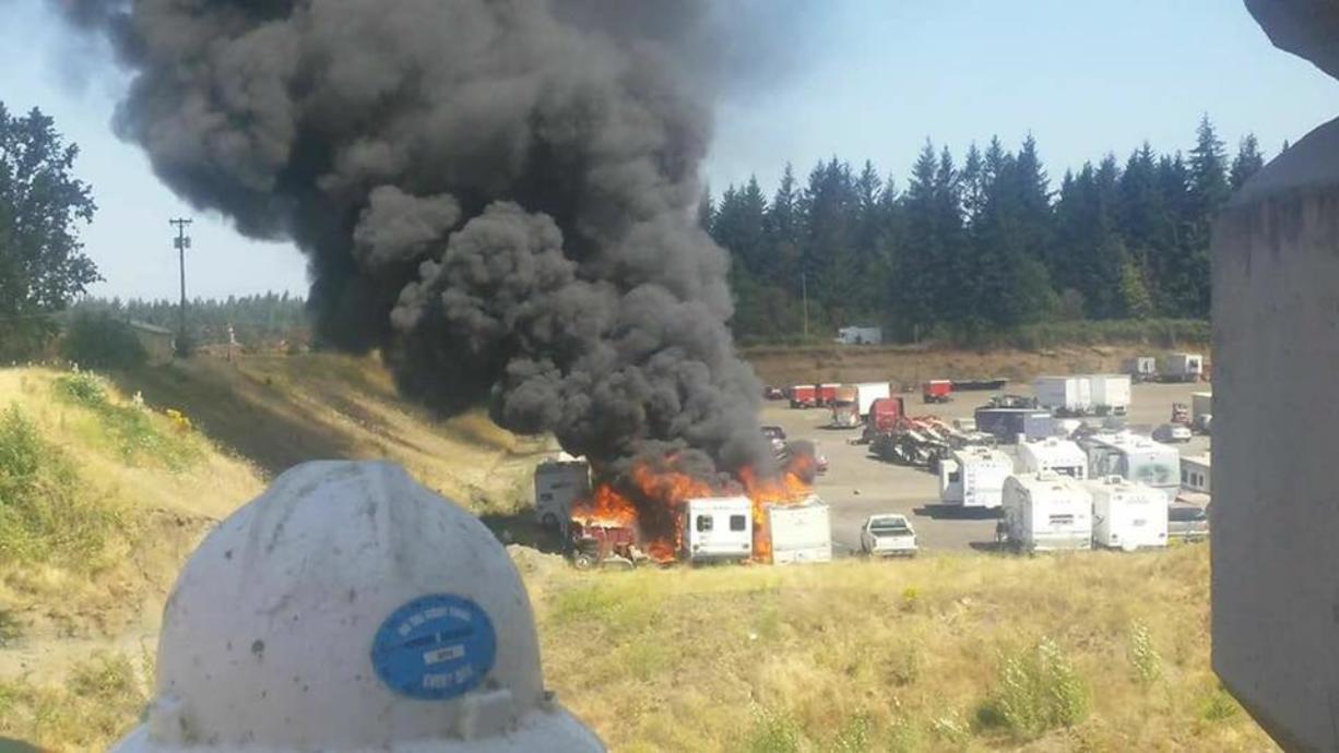 Four RVs at a vehicle storage lot in east Vancouver were destroyed in a fire Wednesday morning.