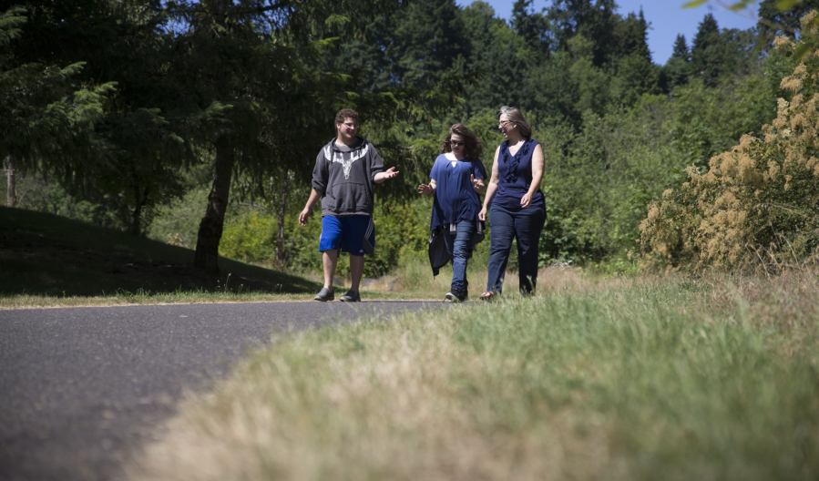 Amy Bounds’ husband, Jeff, uses a wheelchair, so she’s on the lookout for places they can go on family outings. Bounds, right, and two of her children, Rebecca, 15, and Ian, 17, checked out the Salmon Creek Greenway and Trail in Vancouver on July 1. Randy L.