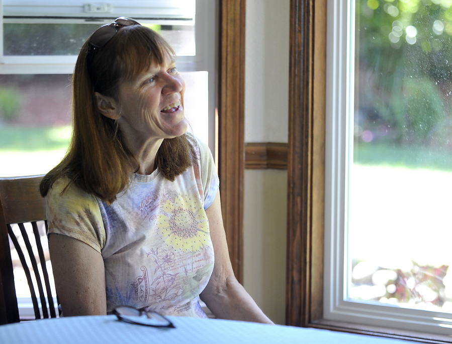 Medford teacher Betsy Whispell speaks at her home July 9 in Medford, Ore. Whispell underwent brain surgery to remove a pituitary gland tumor that was causing abnormal growth of her face, hands and feet.