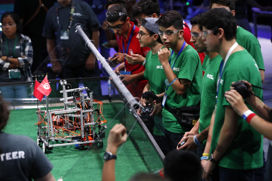 Team Iran, in green, competes in the First Global Robotics Challenge, Tuesday, July 18, 2017, in Washington. The challenge is an international robotics event with teams from over 100 countries.