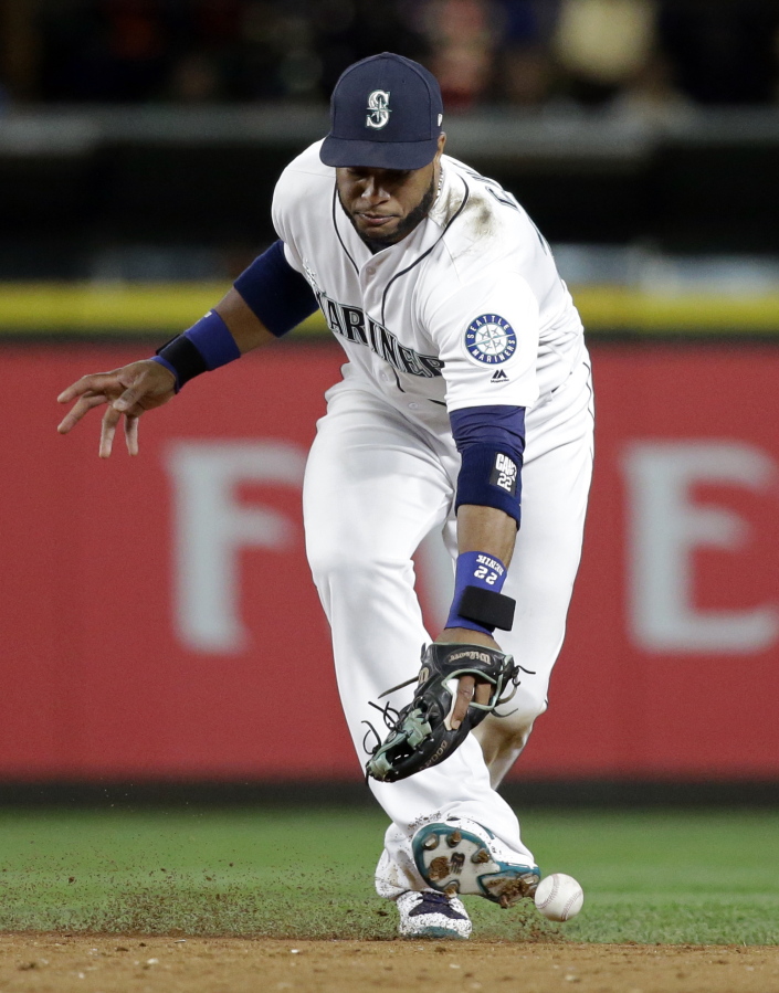 Seattle Mariners second baseman Robinson Cano misplays a grounder from Kansas City Royals’ Lorenzo Cain for an error during the 10th inning of a baseball game Wednesday, July 5, 2017, in Seattle.