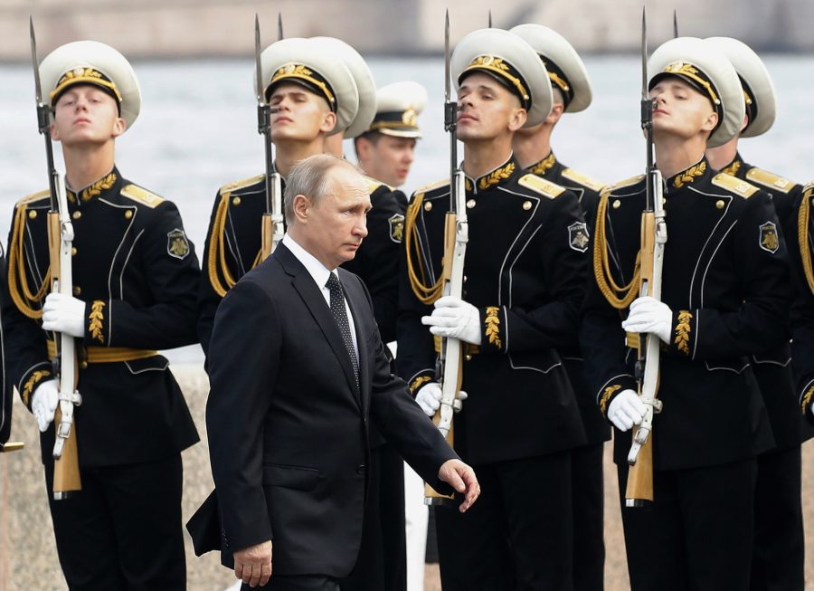 Russian President Vladimir Putin arrives to attend the military parade during the Navy Day celebration in St. Petersburg, Russia, on on Sunday.