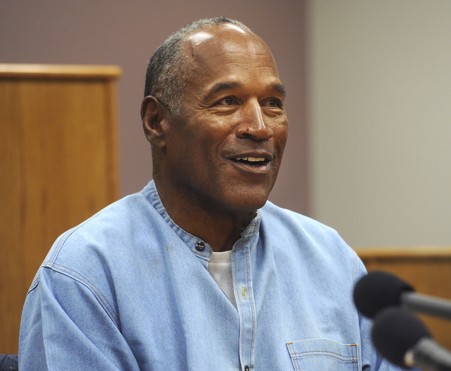 Former NFL football star O.J. Simpson appears via video for his parole hearing at the Lovelock Correctional Center in Lovelock, Nev., on Thursday. Simpson was granted parole Thursday after more than eight years in prison for a Las Vegas hotel heist, successfully making his case in a nationally televised hearing that reflected America’s enduring fascination with the former football star.