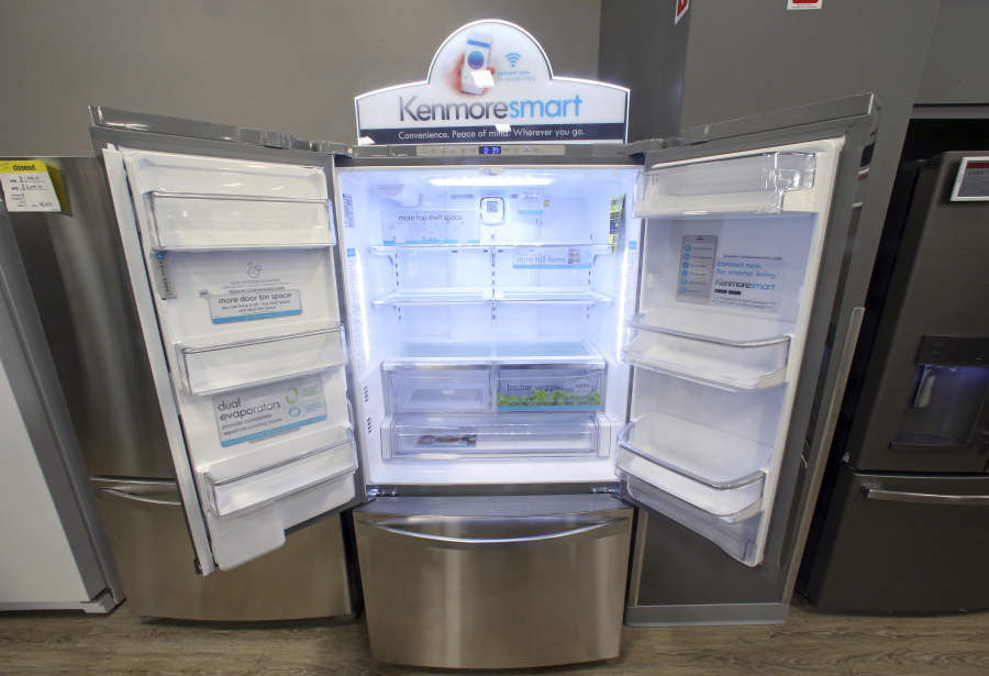 The Kenmore Elite Smart French Door Refrigerator appears Thursday on display at a Sears store in West Jordan, Utah. Sears will begin selling its appliances on Amazon.com, including smart appliances that can be synced with Amazon’s voice assistant, Alexa.