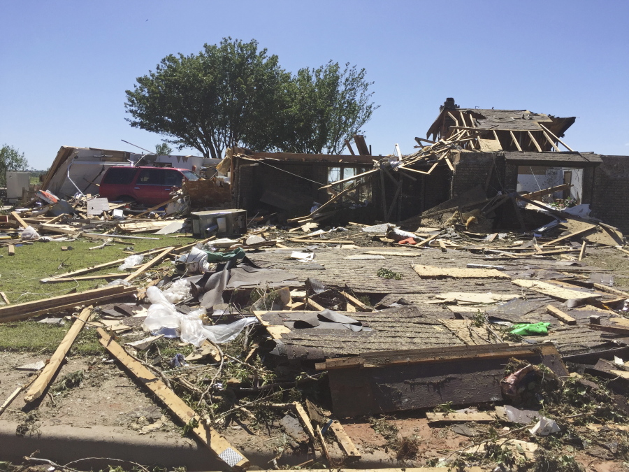 In this May 17, 2017, photo, a home sits destroyed in Elk City, Okla., the day after a tornado swept through the area, killing one. Researchers at the National Weather Center in Norman, Okla., said Friday, July 14, 2017, that it was able to tell 90 minutes before the storm struck that a specific storm cell would cause significant weather in the area.