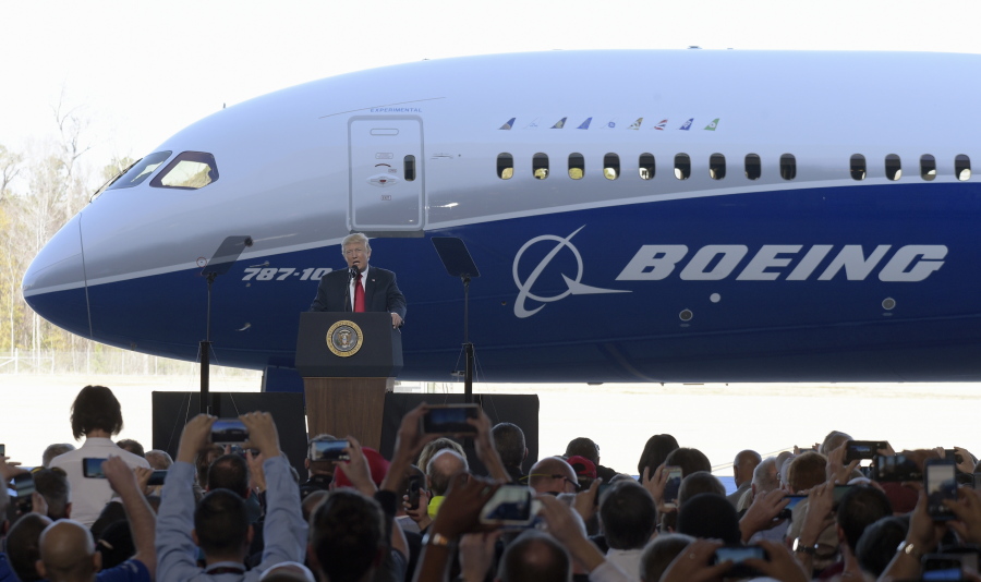 U.S. President Donald Trump speaks Feb. 17 in front of a Boeing 787 Dreamliner while visiting the Boeing South Carolina facility in North Charleston, S.C. Trump’s push to get Americans to embrace goods “Made in USA” is harder than it looks.
