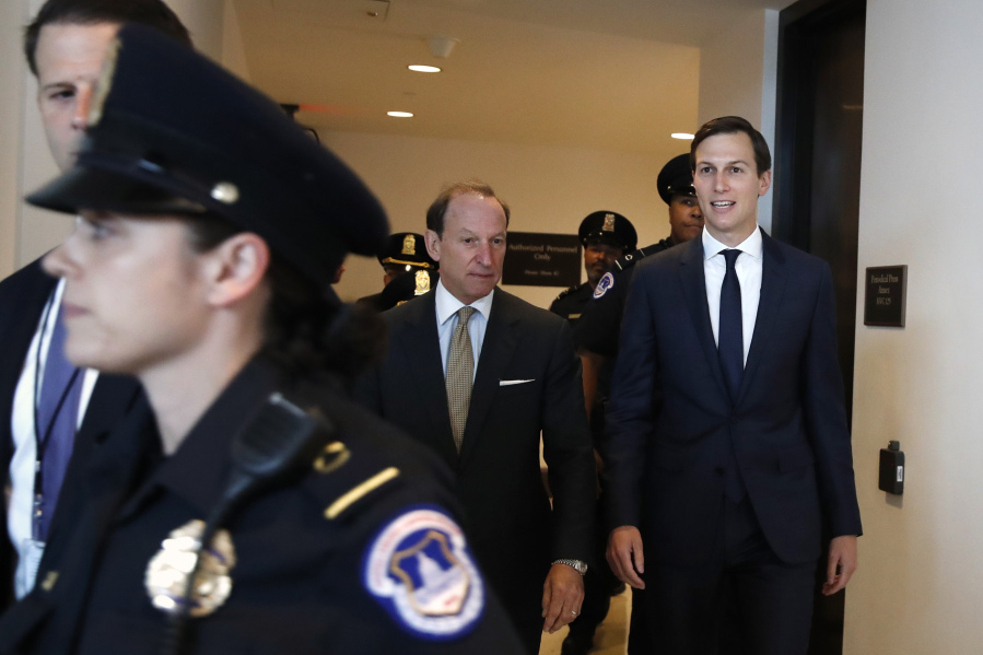 White House adviser Jared Kushner, right, and his attorney Abbe Lowell, center, arrive on Capitol Hill in Washington on Tuesday to be interviewed behind closed doors by the House Intelligence Committee.