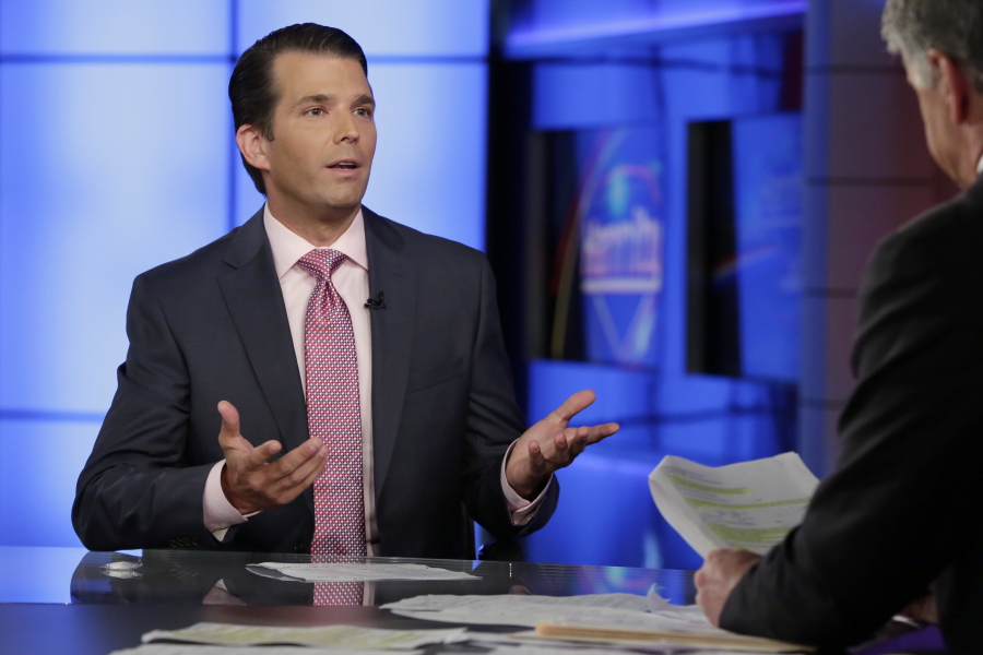FILE - In this July 11, 2017 file photo, Donald Trump Jr., left, speaks in New York. A lawyer for a Russian developer says a company representative was the eighth person at a Trump Tower meeting brokered by Donald Trump Jr. during the campaign.