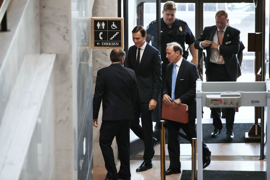 White House senior adviser Jared Kushner, center, accompanied by his attorney Abbe Lowell, arrives on Capitol Hill in Washington on Monday to meet behind closed doors before the Senate Intelligence Committee on the investigation into possible collusion between Russian officials and the Trump campaign.