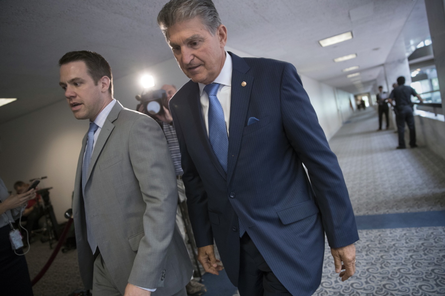 Sen. Joe Manchin, D-W.Va., center, a member of the Senate Intelligence Committee, leaves after a closed-door meeting of that panel on Capitol Hill in Washington, Thursday, July 20, 2017. The Senate intelligence committee has scheduled perhaps the most high-profile testimony involving the Russian meddling probes since former FBI Director James Comey appeared in June. A lawyer for Trump’s powerful son-in-law and adviser says Jared Kushner will speak to the Senate intelligence committee Monday. Donald Trump Jr. is scheduled to appear before the Senate Judiciary Committee next Wednesday along with former campaign chairman Paul Manafort. (AP Photo/J.