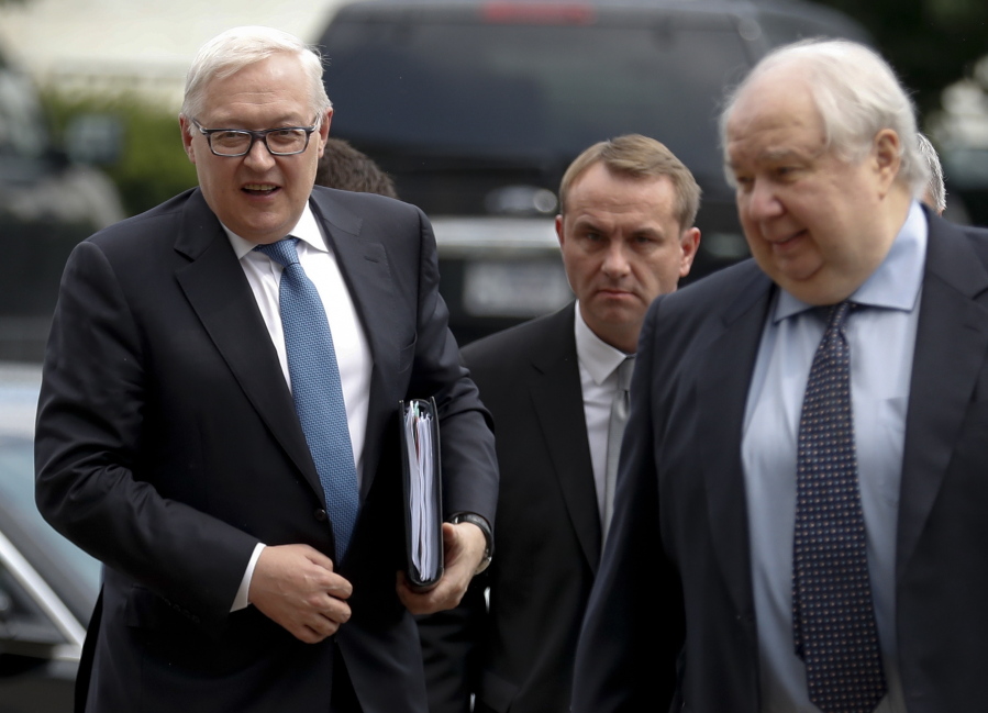 Russian Deputy Foreign Minister Sergei Ryabkov, left, and Russian Ambassador to the U.S. Sergey Kislyak, right, arrive at the State Department in Washington, Monday, to meet with Undersecretary of State Thomas Shannon.