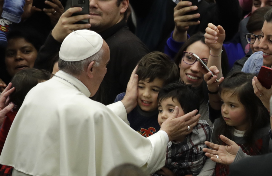 Pope Francis greets children from the Vatican’s Bambino Gesu Pediatric Hospital. During the audience in the Vatican’s Paul VI hall, Francis exhorted hospital caregivers not to fall prey to corruption, which he called the “greatest cancer” that can strike a hospital.