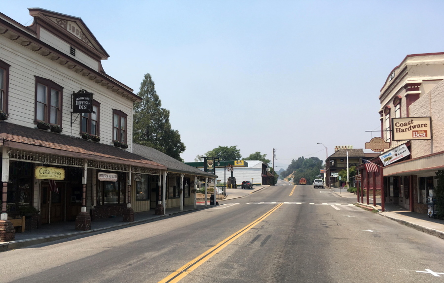 The evacuated downtown of Mariposa, Calif., is viewed Thursday as firefighters battle a large wildfire in the surrounding hills and mountains. Mariposa normally bustles with tourists on their way to Yosemite National Park. The town’s center is made up of old brick and wooden buildings in the holding modern clothing and gift shops, restaurants and wine bars.