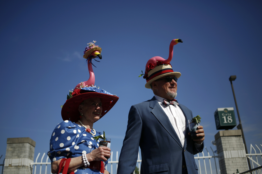 Jan and Scott Baty wear flamingo themed Derby hats on the morning of the 140th running of the Kentucky Derby at Churchill Downs in Louisville, Kentucky in 2014.