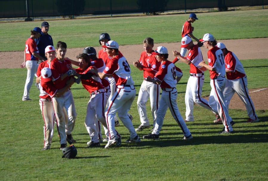 The Camas-Washougal Babe Ruth team celebrates during the 13-15 year old Pacific Northwest Regional tournament last week in Kelso.