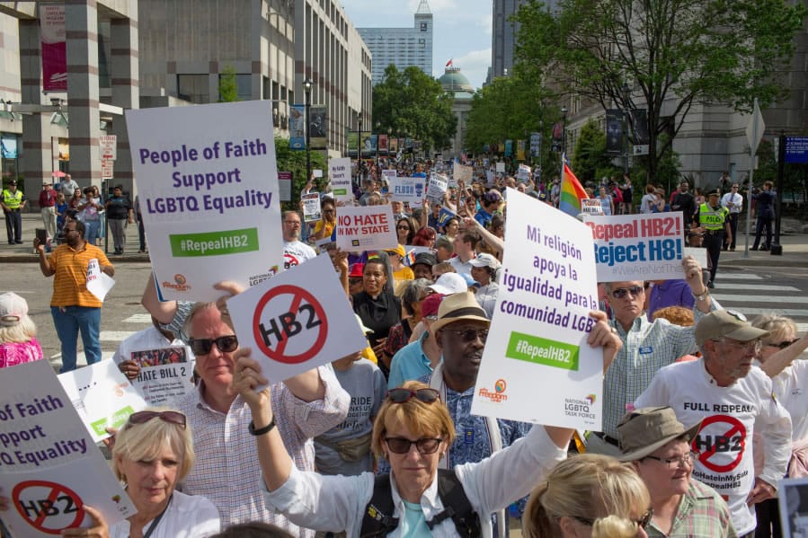 Demonstrators call for the repeal of HB2 in Raleigh, N.C., on April 25, 2016. North Carolina is among six states that some employees have been banned from taking nonessential work trips to.