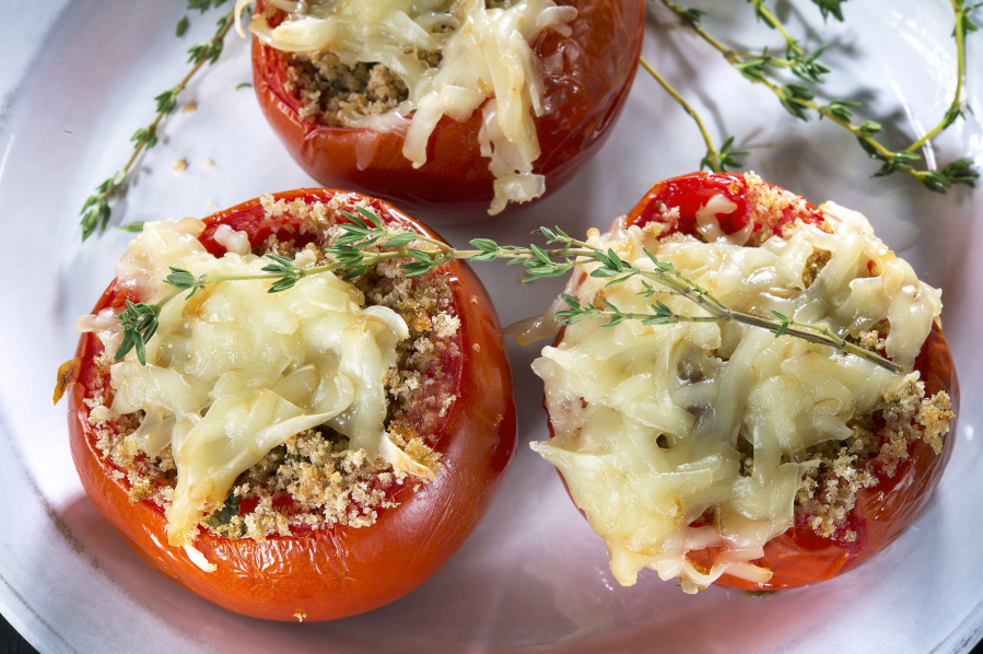Tomatoes Provencal is an ideal use for end-of-summer tomatoes. The whole-wheat breadcrumb stuffing is flavored with garlic, fresh basil and thyme and stuffed into a ripe, juicy tomato.