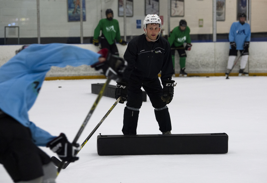 Vancouver native Austin Coldwell instructs players as they run through drills during the ACPHOCKEY summer camp at Mountain View Ice Arena in Vancouver on Friday morning, August 18, 2017.