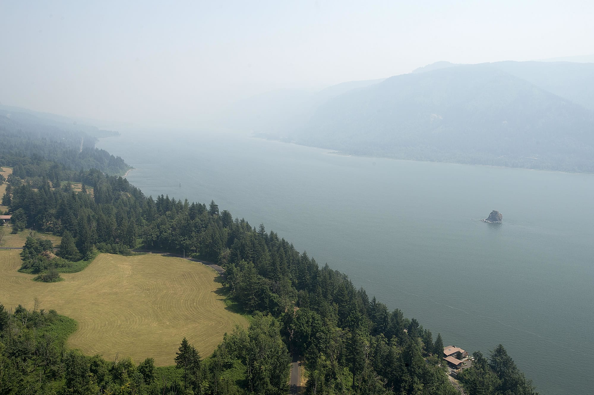 A thick haze obstructs the scenic view of the Columbia River Gorge from the Highway 14 Cape Horn overlook east of Washougal on Wednesday afternoon, Aug. 2, 2017.