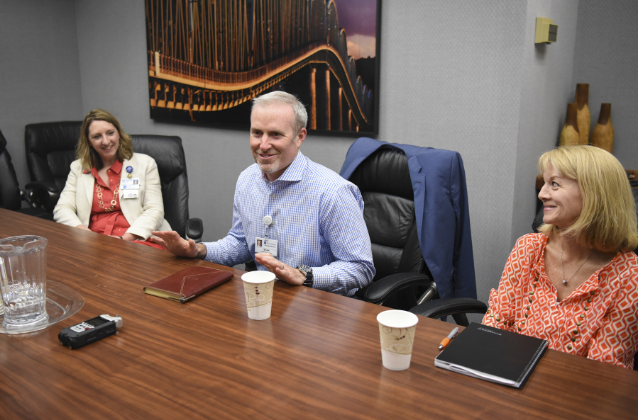 Dr. Robin Virgin, from left, a family medicine physician at PeaceHealth Medical Group, Sean Gregory, chief executive of PeaceHealth’s Columbia Network, and Debra Carnes, director of strategic communication and engagement at PeaceHealth, meet with The Columbian’s Editorial Board on Friday afternoon.