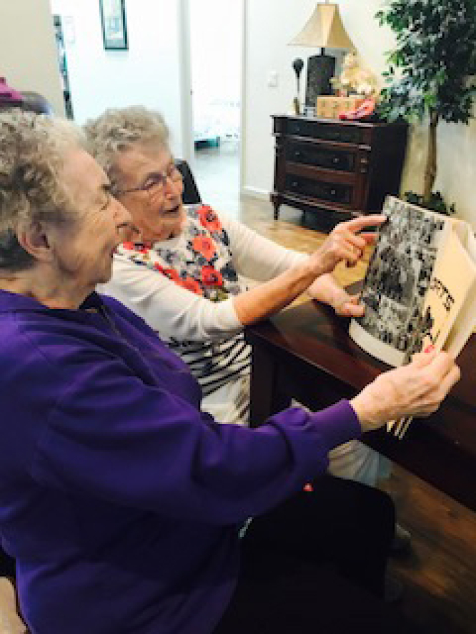 High school pals Annetta Houseman, left, and Marvel Pischer, now in their 90s, recently strolled together down memory lane — looking at high school yearbooks — after Marvel spotted Annetta on the front page of The Columbian.
