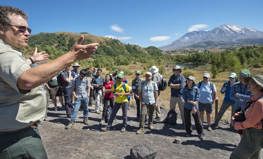 At a stop on the Hummocks Trail, Peter Frenzen, Forest Service scientist at Mount St. Helens, gives an overview of the rebirth of the volcano to a group of international geologists.