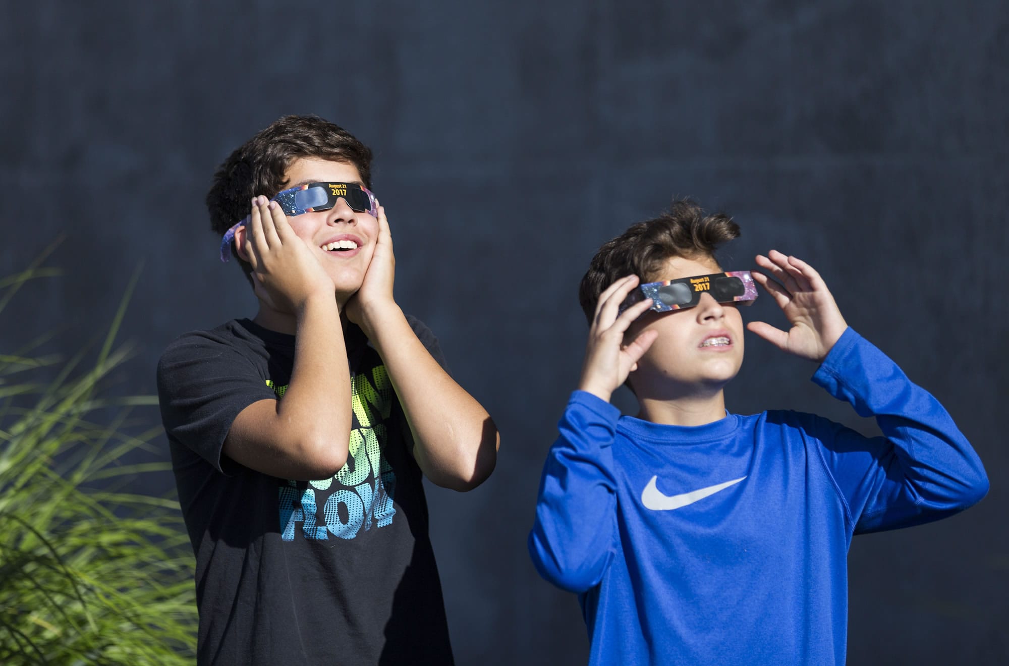 Braden Miller, 14, left, and Jonah Miller, 13, from Vancouver, watch the solar eclipse from Vancouver Community Library in Vancouver on Monday morning, Aug. 21, 2017. The last total solar eclipse that was viewable from the United States was in February 26, 1979.