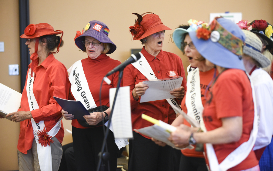 The Portland Raging Grannies, a social activist group, sing their testimony against the Vancouver Energy oil terminal at an Energy Facility Site Evaluation Council hearing Tuesday at Clark College at Columbia Tech Center.