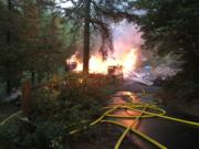 East County Fire and Rescue crews and units from several nearby fire departments responded to a fire early Saturday morning that fully engulfed a log cabin in Washougal.