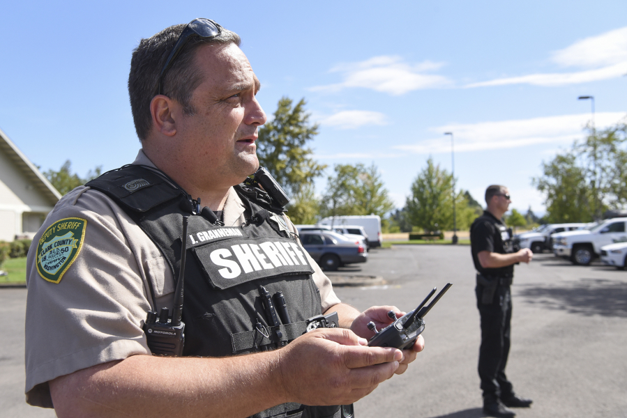 Clark County Sheriff’s Deputy Jason Granneman flies an unmanned aircraft system, also called a drone, outside the Clark County Public Safety Complex. Top: The Clark County Sheriff’s Office now owns five unmanned aircraft, also known as drones, the agency plans to use in situations such as search-and-rescue missions where other aircraft cannot safely fly.