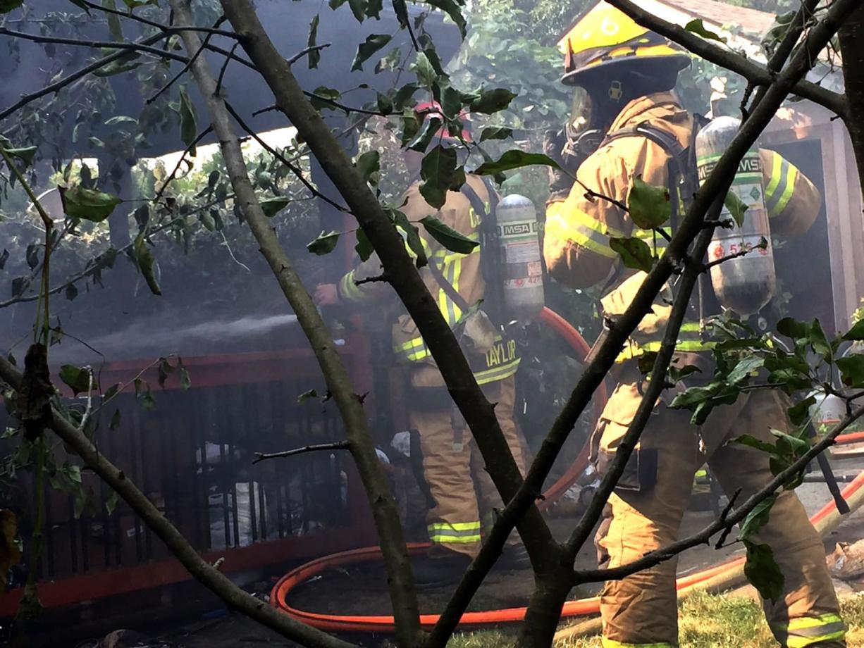 Firefighters quickly doused a blaze that started at one shed and spread to a second nearby shed in North Salmon Creek Thursday morning.