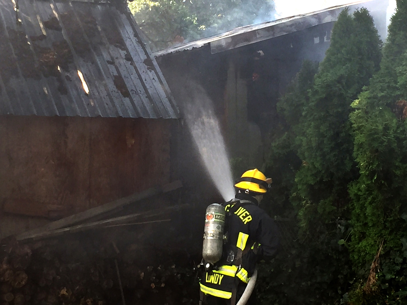 Firefighters quickly doused a blaze that started at one shed and spread to a second nearby shed in North Salmon Creek Thursday morning.