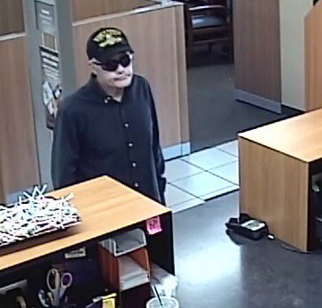 Police are seeking this man -- shown in bank surveillance footage provided by the Clark County Sheriff's Office -- as the suspect in a Monday afternoon bank robbery at a Hazel Dell Chase Bank branch.