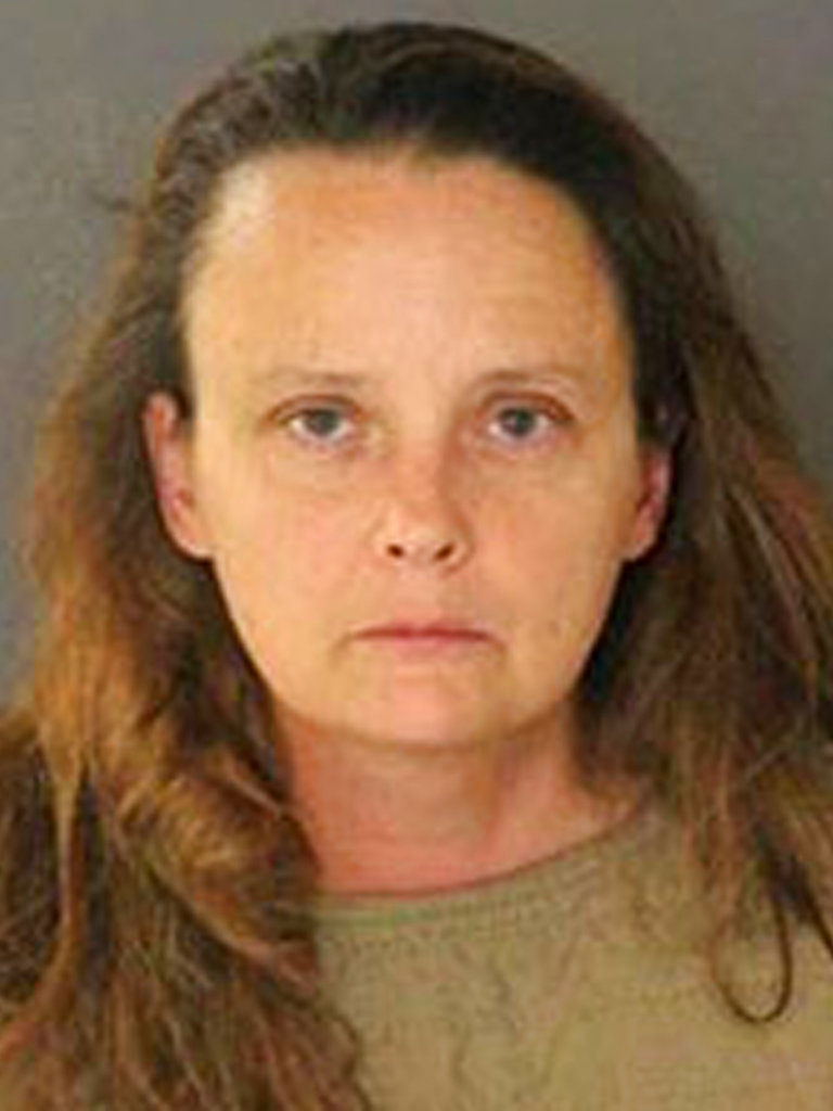 This photo released Thursday, Aug. 3, 2017, by San Jose Police Department shows suspect Gail Burnworth, a resident of Tacoma, Wash., who was one of two people arrested after a sharp-eyed airline passenger saw another traveler texting about sexually assaulting children. San Jose police say they arrested 56-year-old Michael Kellar in the city’s airport Monday night after a flight from Seattle. Officers arrested 50-year-old Gail Burnworth in her Tacoma home.