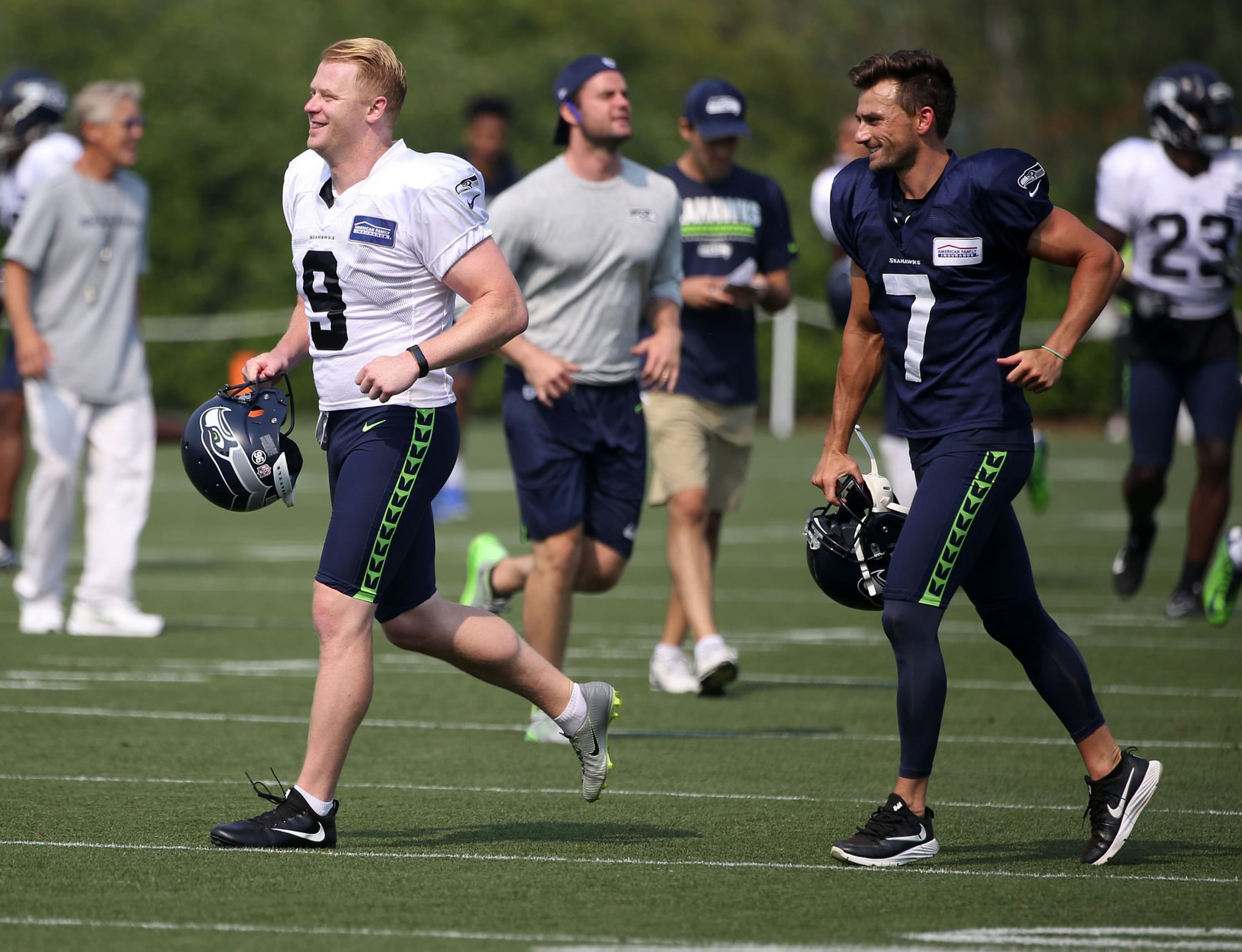 Seattle Seahawks punter Jon Ryan (9) and kicker Blair Walsh (7) take to the field for NFL football training camp, Thursday, Aug. 3, 2017, in Renton, Wash.