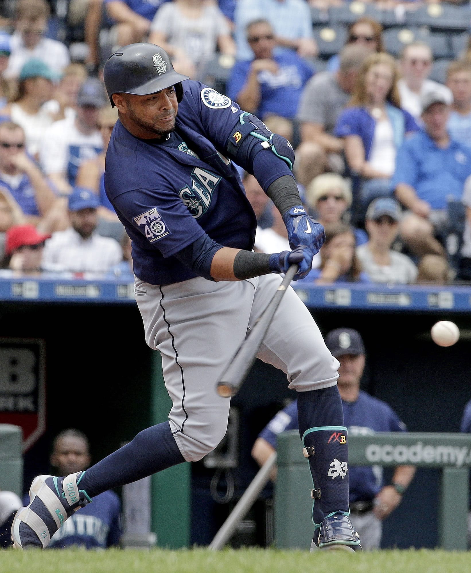 Seattle Mariners' Nelson Cruz hits a three-run home run during the second inning of the first baseball game in a doubleheader against the Kansas City Royals Sunday, Aug. 6, 2017, in Kansas City, Mo.