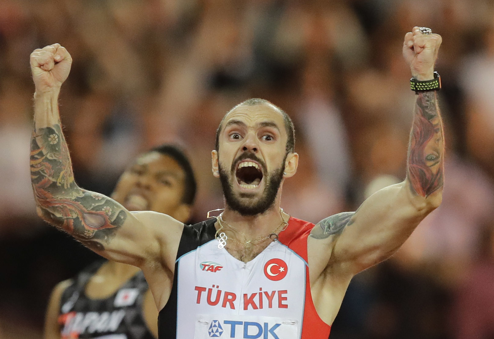 Turkey's Ramil Guliyev crosses the line to win gold in the men's 200-meter final during the World Athletics Championships in London Thursday, Aug. 10, 2017.