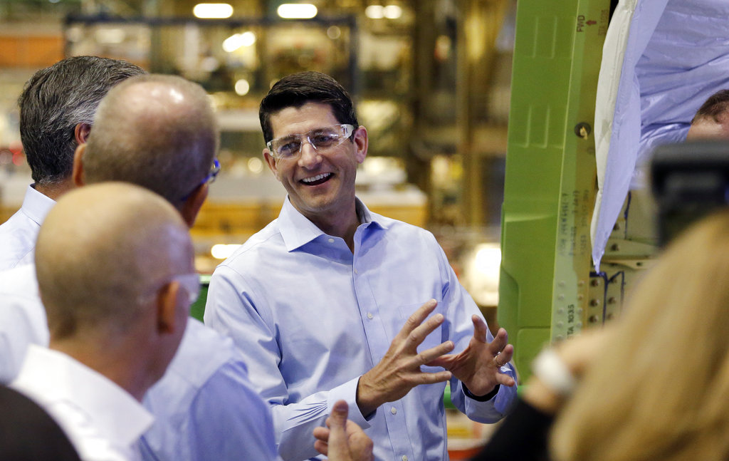 House Speaker Paul Ryan talks with Boeing Co. employees while on a tour of the airplane factory, Thursday, Aug. 24, 2017, in Everett, Wash. Ryan toured the factory before speaking with and taking questions from some of the workers, mostly on tax reform.