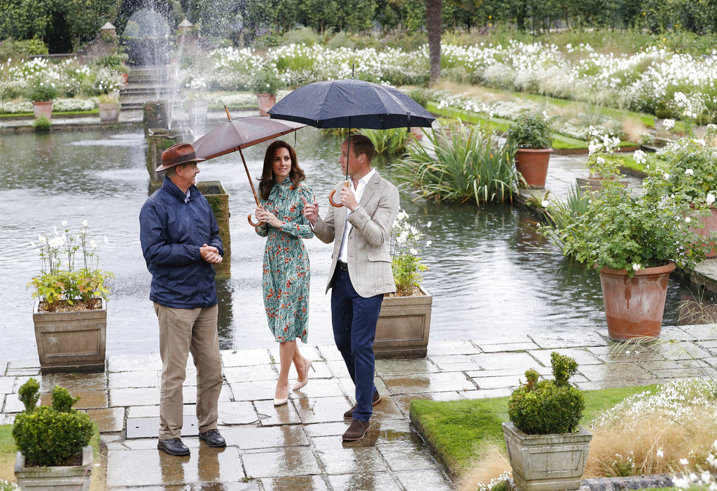 Britain's Prince William, right, and his wife Kate, Duchess of Cambridge are given a tour at the memorial garden in Kensington Palace, London, Wednesday, Aug. 30, 2017. Princes William and Harry are paying tribute to their mother, Princess Diana, on the eve of the 20th anniversary of her death by visiting the Sunken Garden to honor Diana's work with charities.