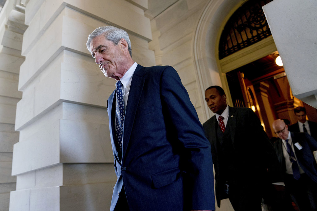 FILE- In this June 21, 2017, file photo, former FBI Director Robert Mueller, the special counsel probing Russian interference in the 2016 election, departs Capitol Hill following a closed door meeting in Washington. A grand jury used by Mueller has heard secret testimony from a Russian-American lobbyist who attended a June 2016 meeting with President Donald Trump's eldest son, The Associated Press has learned.