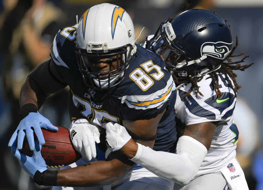 The Chargers’ Antonio Gates (85) hauls in a TD pass as Seahawks defensive back Shaquill Griffin (26) defends. Mark J.