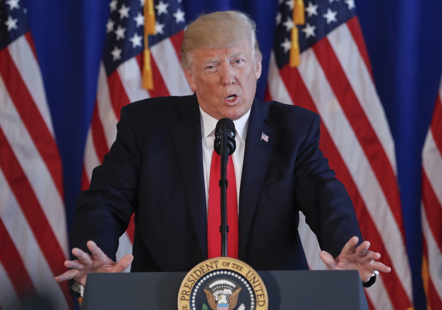 President Donald Trump speaks about the ongoing situation in Charlottesville, Va., at Trump National Golf Club, on Saturday, in Bedminster, N.J.